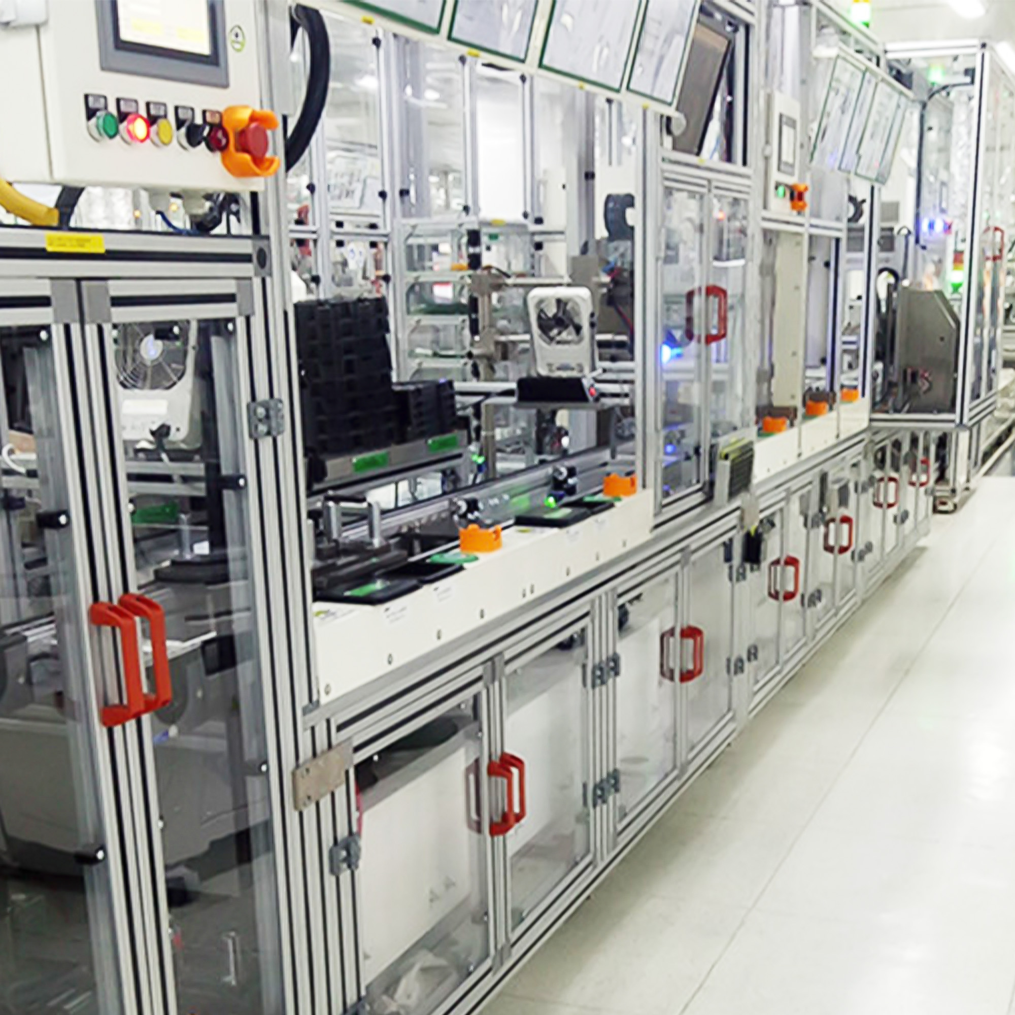 Guarded aluminium-framed automation line with conveyor stations